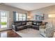 The living room is open and bright and features a leather sofa at 1352 Middlebury Dr, Westfield, IN 46074