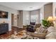 Cozy living room with comfortable seating, area rug and view of entryway at 1352 Middlebury Dr, Westfield, IN 46074