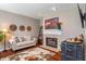 Comfortable living room with fireplace, stylish decor, and ample natural light at 1352 Middlebury Dr, Westfield, IN 46074