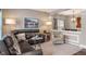 The living room features a leather sofa, an area rug and a view to the dining room at 1352 Middlebury Dr, Westfield, IN 46074