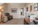 The office has neutral walls, carpet, a lamp and a desk at 1352 Middlebury Dr, Westfield, IN 46074