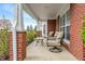 Relaxing front porch featuring comfortable seating and a view of the landscaped yard at 1352 Middlebury Dr, Westfield, IN 46074