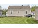 The exterior view shows a backyard with a barbecue area at 1412 Wallace Ave, Indianapolis, IN 46201