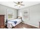 Bright bedroom with two windows and hardwood floors at 1412 Wallace Ave, Indianapolis, IN 46201