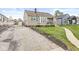 Charming home with front yard, driveway, and green shutters in a quiet neighborhood at 1412 Wallace Ave, Indianapolis, IN 46201