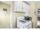 Classic kitchen design with ample counter space and a white gas range at 1412 Wallace Ave, Indianapolis, IN 46201