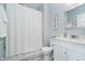 Bathroom featuring a shower with white curtain, a toilet, and a sink with white cabinets at 1453 English Ave, Indianapolis, IN 46201