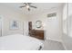 Bright bedroom with a ceiling fan, dresser, and an octagonal mirror on the wall at 1453 English Ave, Indianapolis, IN 46201