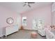 Bright Bedroom with pink walls, white furniture, and a ceiling fan at 1453 English Ave, Indianapolis, IN 46201
