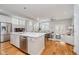 Open-concept kitchen and living area featuring a large island with stainless steel appliances at 1453 English Ave, Indianapolis, IN 46201