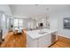 Bright, open kitchen with large island, dining area, and living room with natural light at 1453 English Ave, Indianapolis, IN 46201