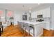 Modern kitchen with a large island, stainless steel appliances, and hardwood floors at 1453 English Ave, Indianapolis, IN 46201