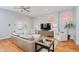 Cozy living room with hardwood floors, stylish furniture, and a modern entertainment center at 1453 English Ave, Indianapolis, IN 46201