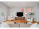 Inviting living room with hardwood floors, two chairs, and a contemporary entertainment center at 1453 English Ave, Indianapolis, IN 46201