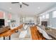 Spacious living room with open concept floor plan to kitchen and dining areas, bathed in natural light at 1453 English Ave, Indianapolis, IN 46201