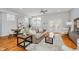 Bright and spacious living area with hardwood floors, modern decor, and a comfortable seating area at 1453 English Ave, Indianapolis, IN 46201