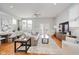 Bright living room featuring hardwood floors, modern furniture, and lots of natural light at 1453 English Ave, Indianapolis, IN 46201