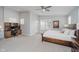 Spacious main bedroom with a desk, chair, and a large window with a view of the backyard at 1453 English Ave, Indianapolis, IN 46201