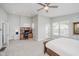 Spacious main bedroom with a ceiling fan, a desk, and large windows that let in natural light at 1453 English Ave, Indianapolis, IN 46201