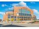 Exterior of Lucas Oil Stadium in Indianapolis on a sunny day with a blue sky and some trees at 1453 English Ave, Indianapolis, IN 46201