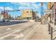 Street view with businesses, signage, traffic lights, and architectural views under a clear sky at 1453 English Ave, Indianapolis, IN 46201