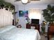 Bright bedroom featuring a TV and tropical decor at 14544 Lynn Ave, Fishers, IN 46038