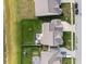 Aerial view of a backyard with patio, seating, green lawn, and a playset, perfect for outdoor living at 15986 Bugle Ridge Dr, Noblesville, IN 46060