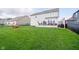 Expansive backyard with well-maintained lawn, deck, and ample space for outdoor activities at 15986 Bugle Ridge Dr, Noblesville, IN 46060