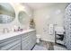 Well-lit bathroom featuring a double vanity, modern fixtures, and decorative accents at 15986 Bugle Ridge Dr, Noblesville, IN 46060