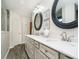 Bright bathroom with double vanity, white countertop, framed mirrors, and updated fixtures at 15986 Bugle Ridge Dr, Noblesville, IN 46060