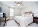 Inviting bedroom with a ceiling fan, soft lighting, and a plush rug at 15986 Bugle Ridge Dr, Noblesville, IN 46060