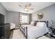 Cozy bedroom features a plush rug, ceiling fan, and comfortable bedding for relaxation at 15986 Bugle Ridge Dr, Noblesville, IN 46060