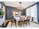 Charming dining room featuring an elegant chandelier, statement mirror, and decorative rug at 15986 Bugle Ridge Dr, Noblesville, IN 46060