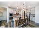 Modern kitchen with a large island, stainless steel appliances, and stylish pendant lighting at 15986 Bugle Ridge Dr, Noblesville, IN 46060