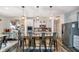 Spacious kitchen featuring an island with seating, stainless steel appliances, and modern cabinetry at 15986 Bugle Ridge Dr, Noblesville, IN 46060