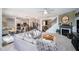 Open-concept living room flowing into the kitchen, featuring a fireplace and comfortable furnishings at 15986 Bugle Ridge Dr, Noblesville, IN 46060