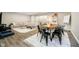 Inviting living room with a plush sofa, dining table, and stylish decor at 15986 Bugle Ridge Dr, Noblesville, IN 46060