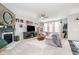 Cozy living room with a fireplace, comfortable seating, and plenty of natural light at 15986 Bugle Ridge Dr, Noblesville, IN 46060