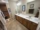 Bathroom featuring a double vanity, wood cabinets, and tile flooring at 160 Bay Ridge Dr, Pendleton, IN 46064