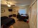 Bedroom with twin beds, ceiling fan, a desk, and neutral carpeting at 160 Bay Ridge Dr, Pendleton, IN 46064