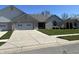 Charming single-story home with attached garage, well-maintained lawn, and long concrete driveway at 160 Bay Ridge Dr, Pendleton, IN 46064