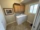 Laundry room with a washer, dryer, and upper cabinets at 160 Bay Ridge Dr, Pendleton, IN 46064
