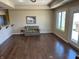Relaxing living area with hardwood floors, natural light, and access to outdoor patio at 160 Bay Ridge Dr, Pendleton, IN 46064