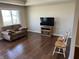 Open living area with hardwood floors, a large window, and comfortable seating at 160 Bay Ridge Dr, Pendleton, IN 46064