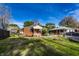 The property features a spacious backyard with a brick home, patio and fire pit at 1733 N Spencer Ave, Indianapolis, IN 46218