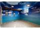 Finished basement with blue walls and cloud painting on the ceiling at 1733 N Spencer Ave, Indianapolis, IN 46218