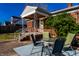 Charming front porch with outdoor seating and brick facade at 1733 N Spencer Ave, Indianapolis, IN 46218