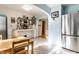 Eat-in kitchen featuring a stainless steel refrigerator, white countertops, and light blue walls at 1733 N Spencer Ave, Indianapolis, IN 46218