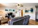 Comfortable living room with hardwood flooring, a gray sofa, and natural light at 1733 N Spencer Ave, Indianapolis, IN 46218
