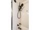 Modern shower with a handheld shower head and neutral tile at 1733 N Spencer Ave, Indianapolis, IN 46218